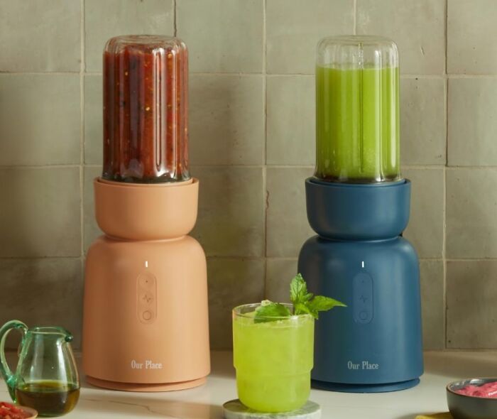 Two modern blenders with green and red blended drinks showcasing gifts for holiday shopping before it starts