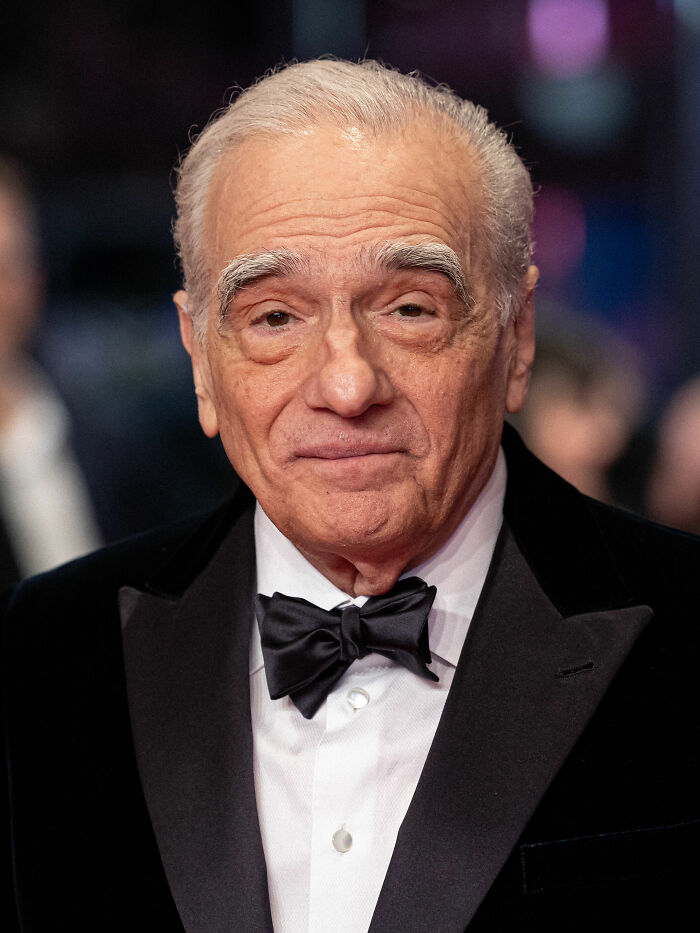 Martin Scorsese wearing a black tuxedo and bow tie at a formal event, highlighting his bio and career highlights.