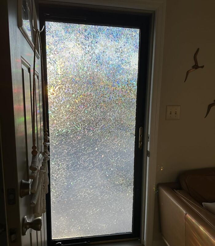 Textured glass door letting in soft natural light, a cozy find to make your house feel warm and inviting.