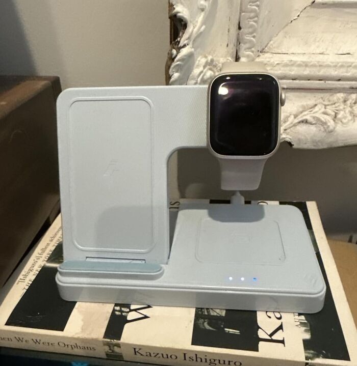 Wireless charging station with smartwatch on top, a sleek tech deal perfect for Black Friday wishlist must-haves.