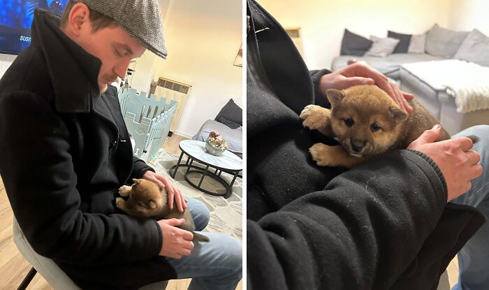 Man holding and cuddling a small puppy indoors, capturing a heartwarming moment of dreams turned into reality.