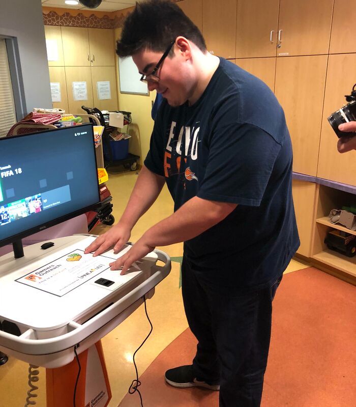 Teen turning his dream into reality using a gaming device, inspiring the internet with his achievement and joy.