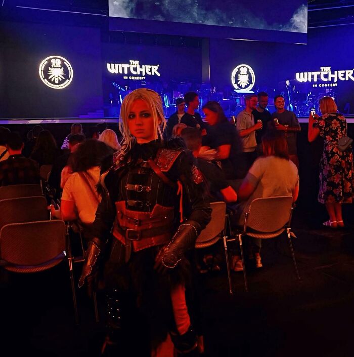 Cosplayer dressed as The Witcher character at a concert event, showcasing dreams turned into reality and inspiring the internet.