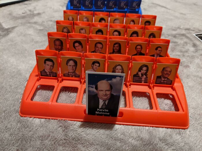 Guess Who game featuring characters from The Office arranged on an orange board, capturing sibling gratitude moments.