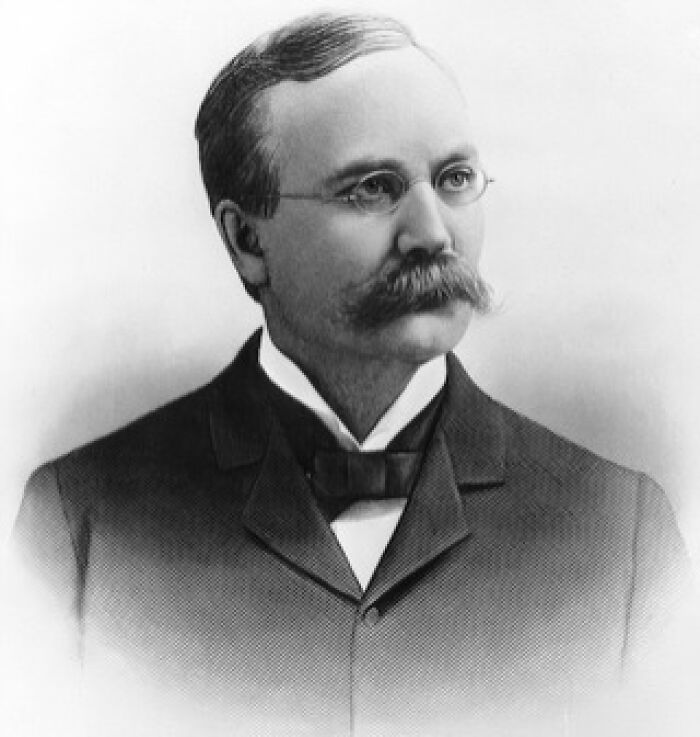 Black and white portrait of a man with glasses and a mustache representing hilarious historical events that sound made-up.