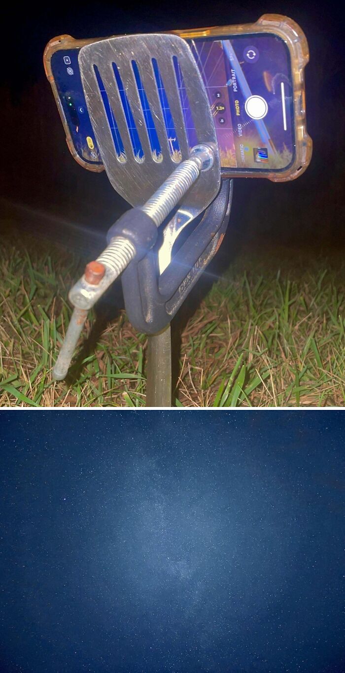 Improvised smartphone holder made from a spatula and clamp captures starry night sky photo outdoors.