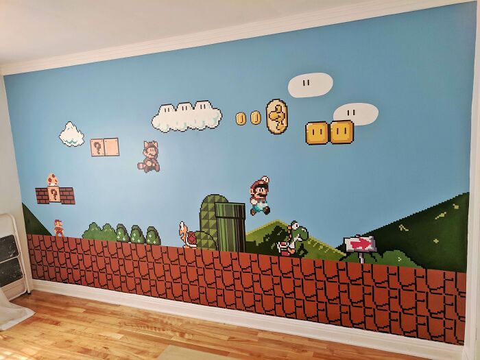 Super Mario Bros themed mural on wall with pixelated characters and objects, evoking gratitude and sibling joy.