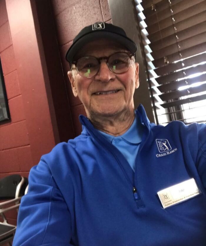 Elderly man wearing glasses and blue jacket smiling indoors, representing people turning dreams into reality and inspiring the internet.
