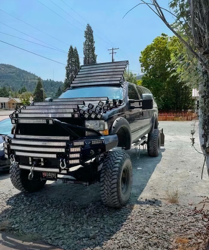 Off-road vehicle overloaded with numerous LED light bars and panels, showing an extreme attempt to make a car cooler.