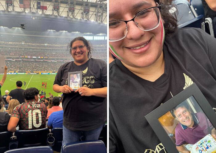 Smiling woman holding a framed photo at a crowded stadium, capturing a wholesome internet moment of connection and joy.