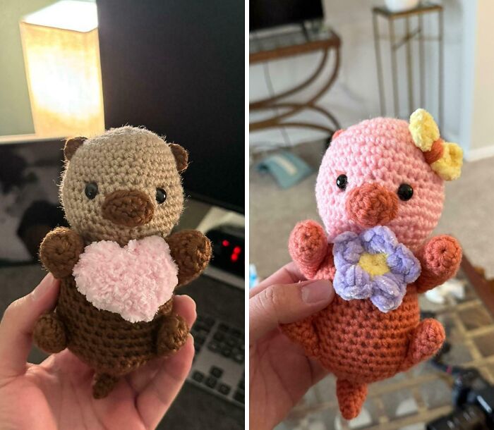 Two handmade crocheted toys, a bear holding a pink heart and a duck with a purple flower, showcasing wholesome internet moments.