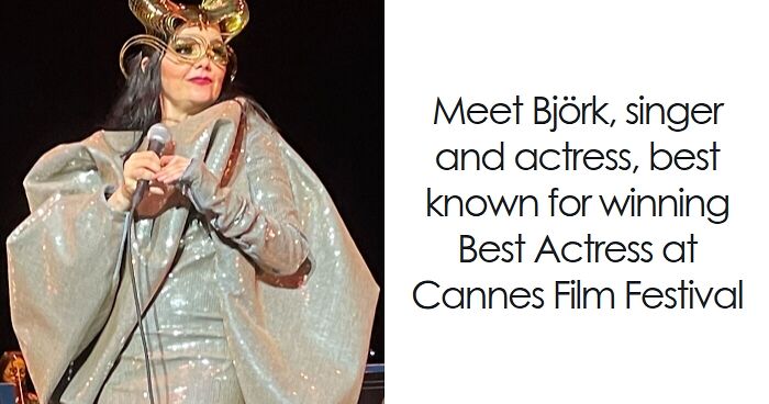 Bju00f6rk performing on stage wearing a metallic outfit and unique headpiece during a live music event.