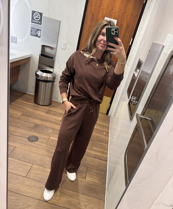 Woman taking a mirror selfie wearing a brown lounge set and white sneakers, styled for Alix Earle Amazon Black Friday deals.