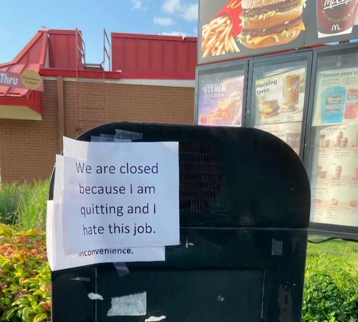 Drive-thru speaker with a sign saying closed because employee is quitting, showcasing employee jokes and pranks.