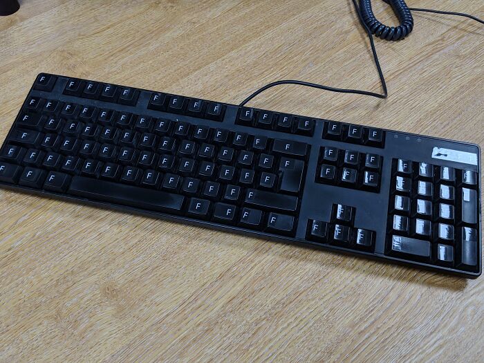 Black keyboard prank with only F keys visible, highlighting jokes and pranks by employees walking out with zero regrets.