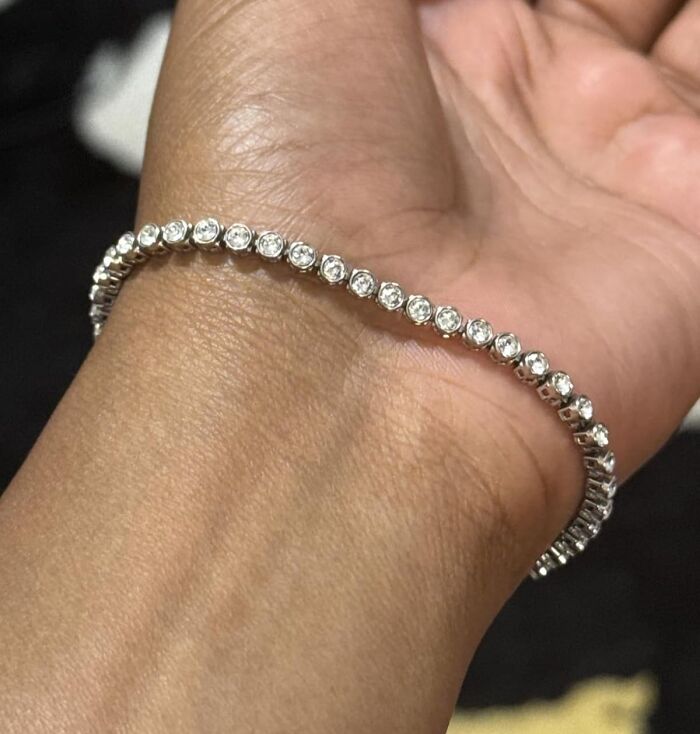 Close-up of a sparkling bracelet on wrist, a stylish stocking stuffer perfect for Black Friday deals and holiday gifts.
