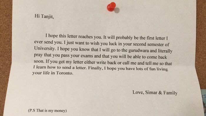 Handwritten letter pinned on a board expressing gratitude and support from a sibling to encourage success.