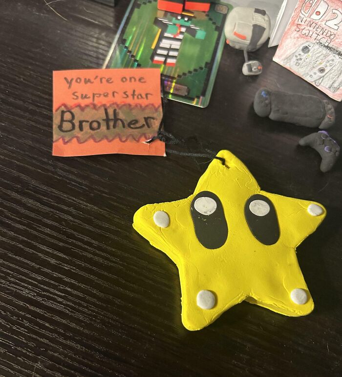 Yellow star keychain with a note saying you’re one superstar brother, showing sibling appreciation and gratitude.