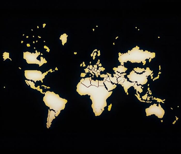 Glowing world map with continents highlighted, illustrating a unique view to see our world in a different light.