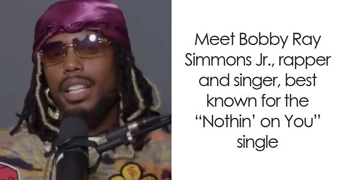 B.o.B wearing sunglasses and a purple headscarf, speaking into a microphone during an interview session.