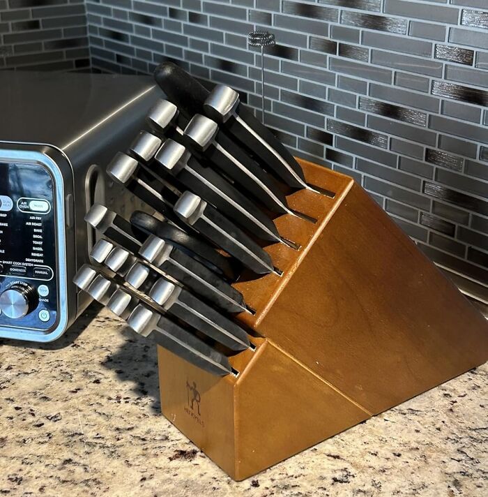 Knife set displayed on a kitchen counter next to a toaster oven, featured in popular Cyber Monday deals this year.