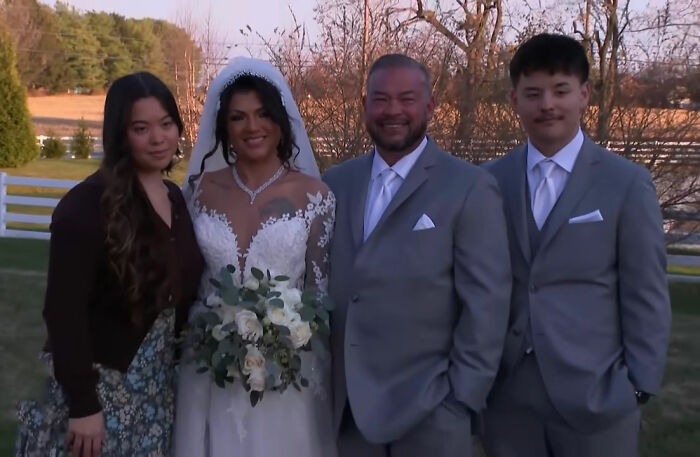 Jon Gosselin in a wedding suit with bride and two family members outdoors, celebrating marriage 16 years later. Jon Gosselin in a wedding suit with bride and two family members outdoors, celebrating marriage 16 years later.