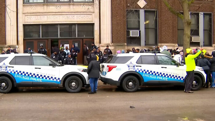 Chicago police outside Orvillet Bright Public School with crowd gathered after incident involving young school kids and pregnant woman. Chicago police outside Orvillet Bright Public School with crowd gathered after incident involving young school kids and pregnant woman.
