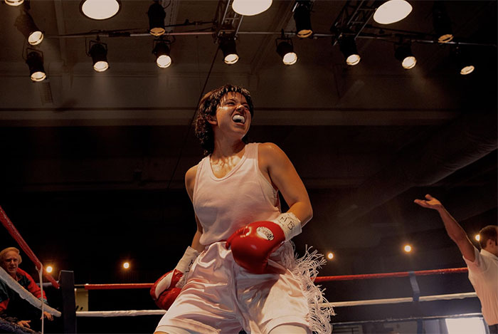 Boxing athlete celebrating victory inside ring under bright lights with leaked PR emails sparking damage control efforts. Boxing athlete celebrating victory inside ring under bright lights with leaked PR emails sparking damage control efforts.