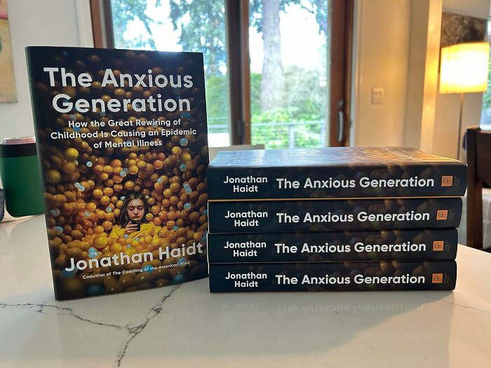 Stack of The Anxious Generation books displayed as Black Friday deals to add to your wishlist for savings and discounts.