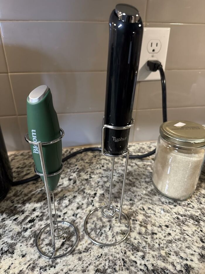 Two handheld milk frothers on a kitchen counter, featured in Alix Earle’s Amazon store Black Friday deals.