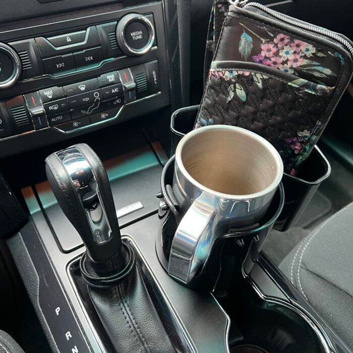 That Giant, Emotional-Support Water Bottle That Currently Rolls Around On Your Passenger Seat Like A Loose Cannon Will Finally Have A Secure Home With This Cup Holder Extender 