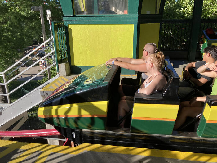 Couple rescuing terrified girl on roller coaster with 205-foot drop after seat belt malfunction during the ride.