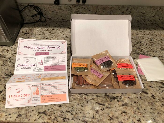 Holiday spice kit with labeled ingredients and recipe cards, a perfect gift idea for impossible to shop for people.