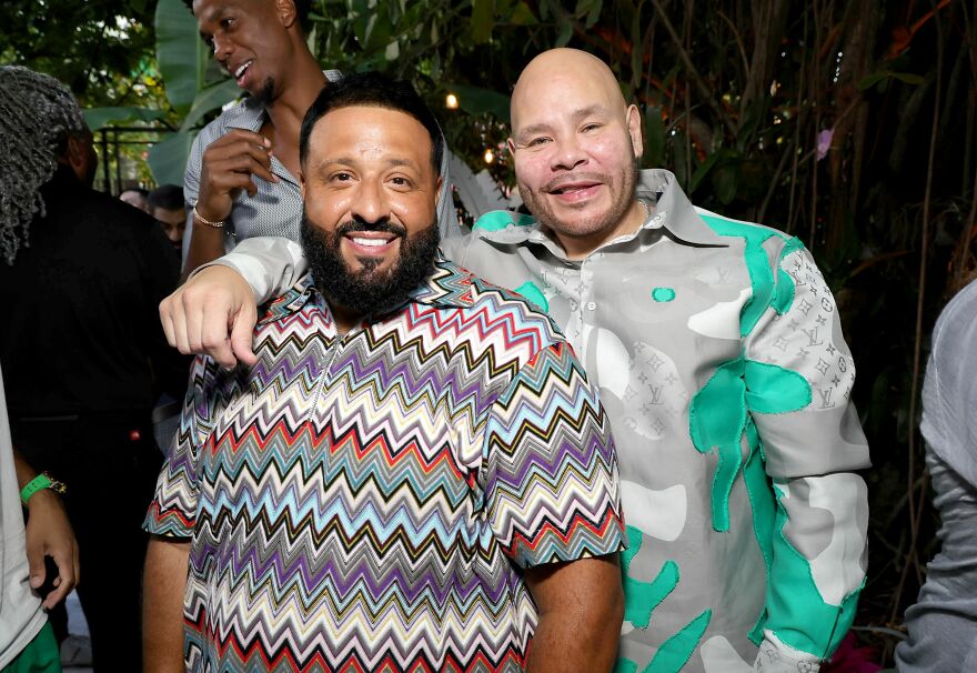 Dj Khaled And Fat Joe smiling at an event, showcasing unexpected faces on members-only fan pages.