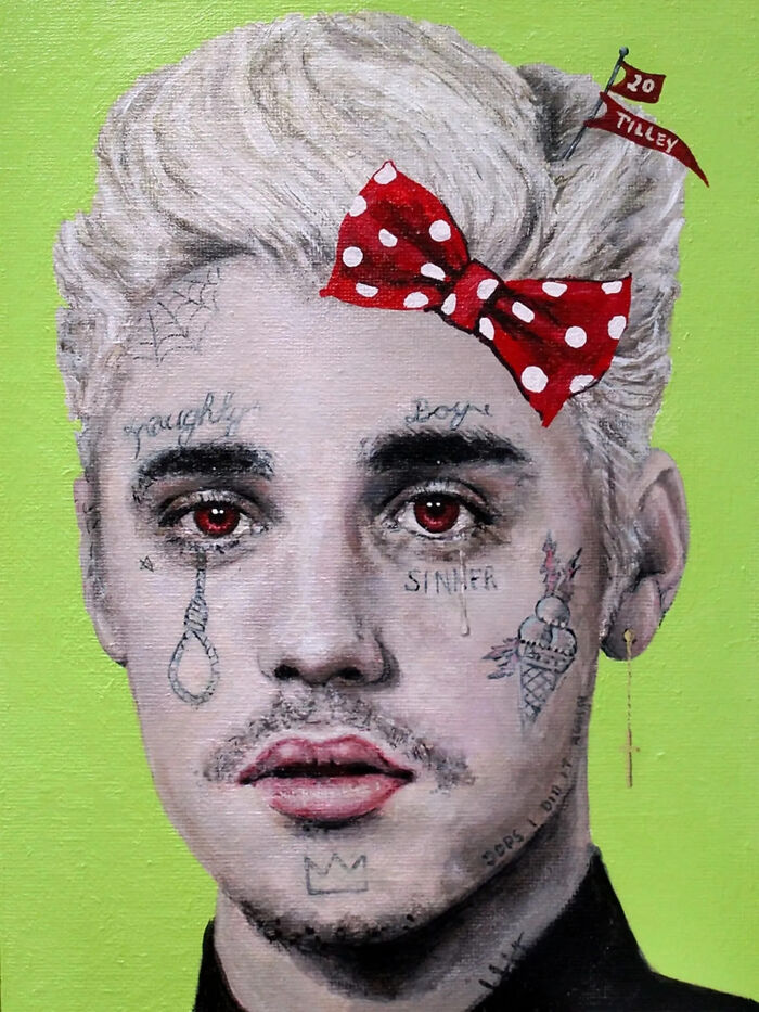 Close-up of a creepy painting by Tyler Tilley featuring red eyes, detailed face tattoos, and a red polka dot bow.