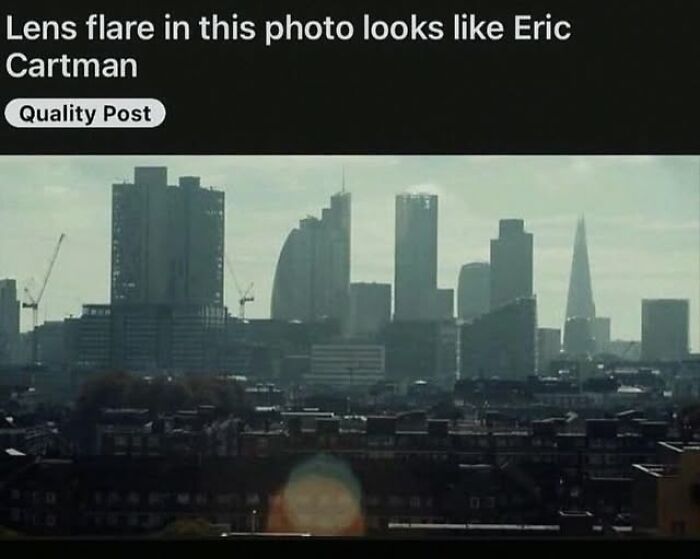 City skyline photo with lens flare that resembles a cartoon character, popular among pics that go hard online.