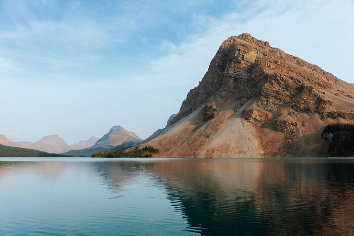 Mountain landscape reflected in calm lake water, symbolizing a journey to find purpose and clarity. Mountain landscape reflected in calm lake water, symbolizing a journey to find purpose and clarity.