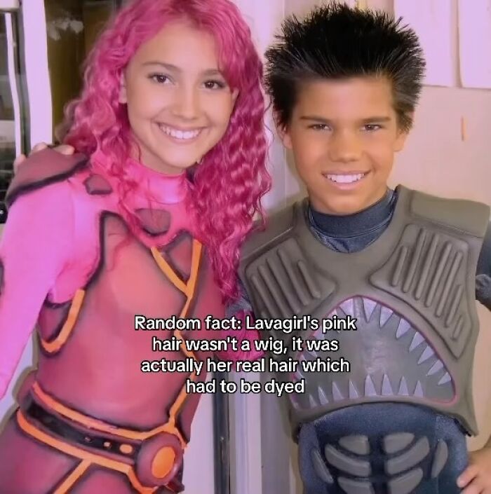 Two young people in colorful costumes with pink hair and spiked hair, showcasing makeup and fashion in a diva life style.