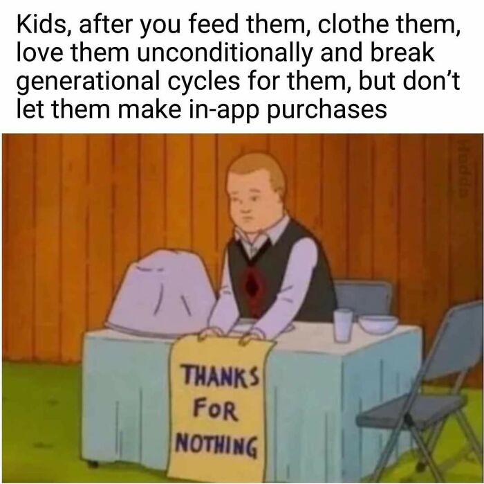 Child sitting at a table with a sign reading thanks for nothing, illustrating funny memes for dads who just want to game in peace.