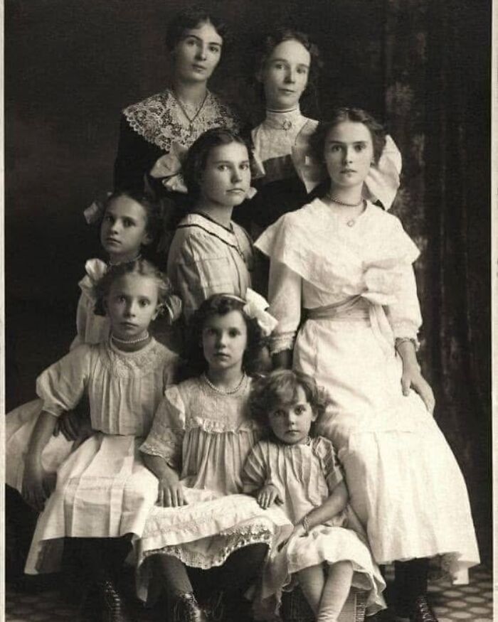 Victorian era portrait of women and children in period clothing showcasing weird photos from the Victorian era.