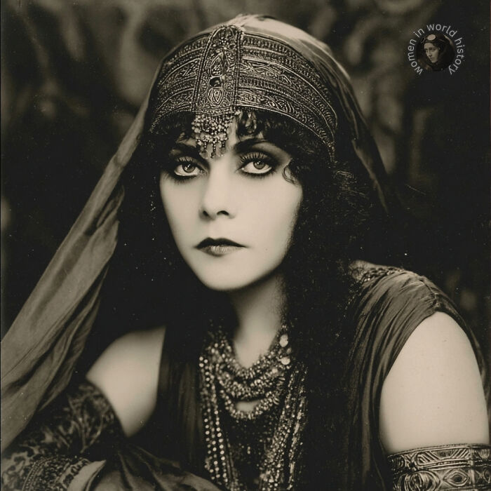 Vintage portrait of a woman wearing ornate jewelry and headpiece, representing overlooked women in history and their achievements.