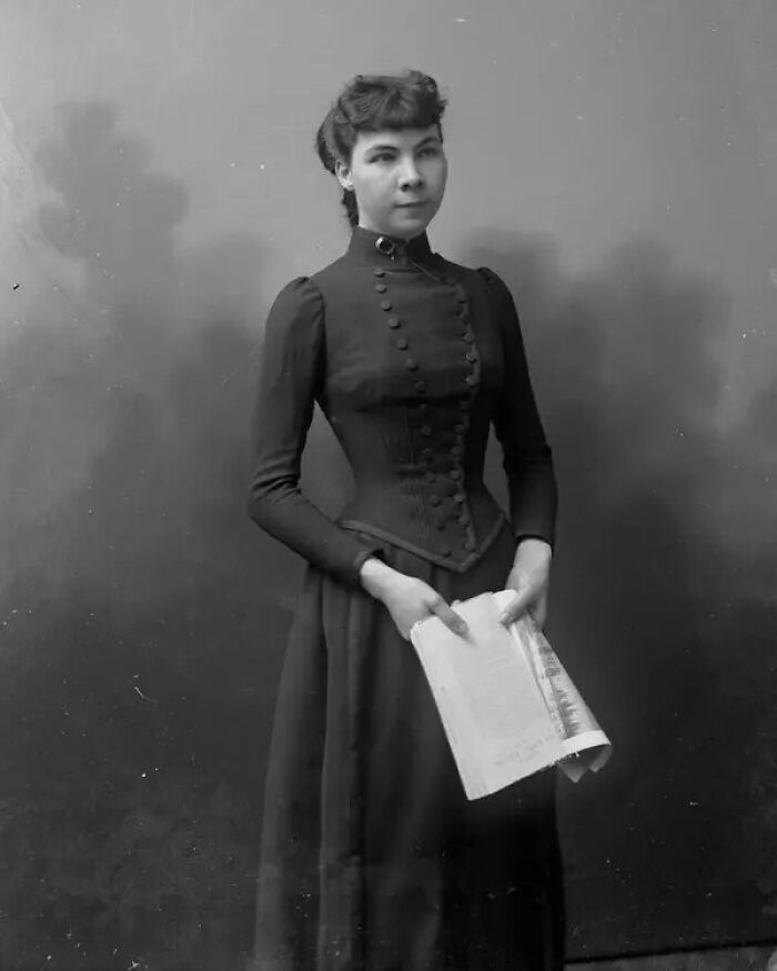 Portrait of a woman from history holding a book, representing overlooked women and their important achievements.
