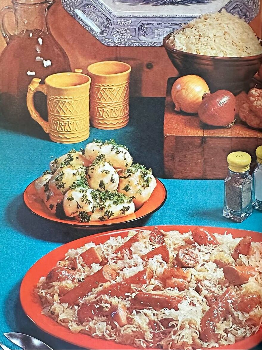 Vintage recipes display unusual dishes on colorful plates with herbs, onions, and traditional pottery on a blue tablecloth.