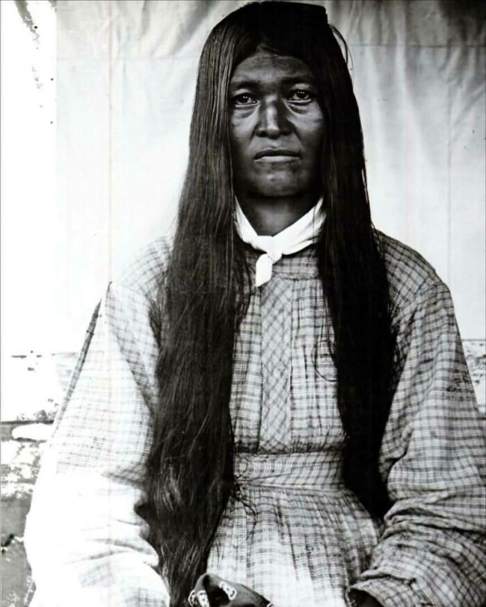 Black and white portrait of a Native American woman with long hair, representing overlooked women in history and their achievements.