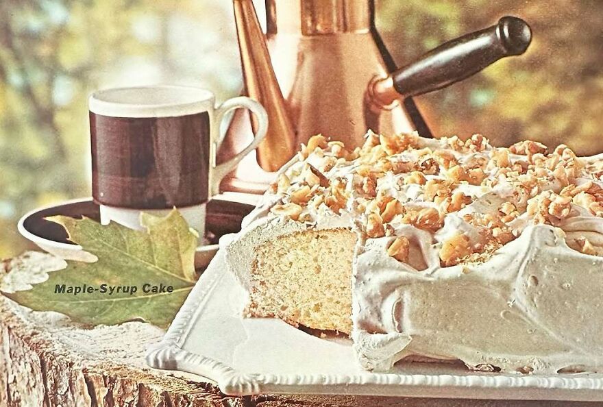 Vintage maple-syrup cake with nuts on rustic plate next to coffee cup, showcasing interesting vintage recipes from the past.