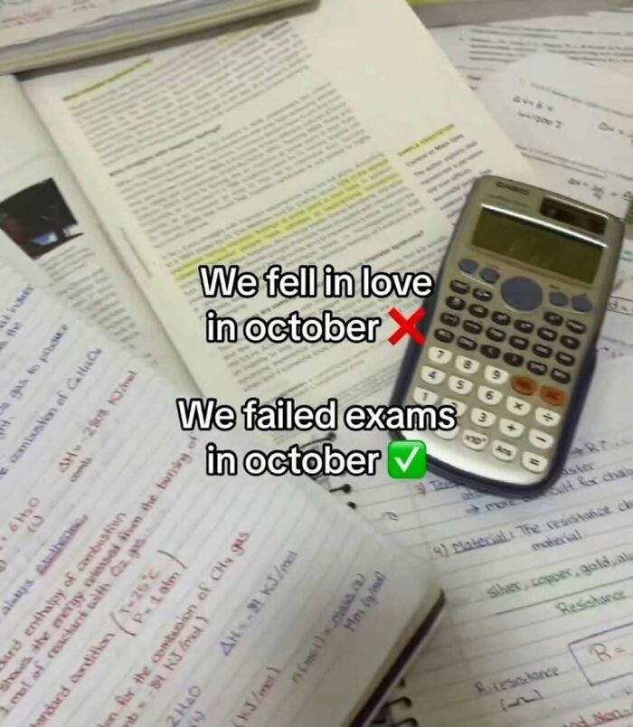 Open textbooks and notes with a calculator showing a funny educational meme about failing exams in October.