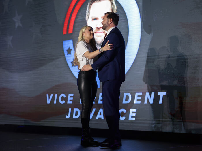 Erika Kirk and JD Vance share an emotional moment on stage at TPUSA event with Vice President JD Vance backdrop. Erika Kirk and JD Vance share an emotional moment on stage at TPUSA event with Vice President JD Vance backdrop.