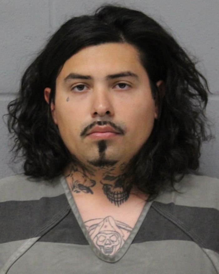 Mugshot of a man with long dark hair and tattoos, linked to woman found chained in backyard in bizarre case. Mugshot of a man with long dark hair and tattoos, linked to woman found chained in backyard in bizarre case.