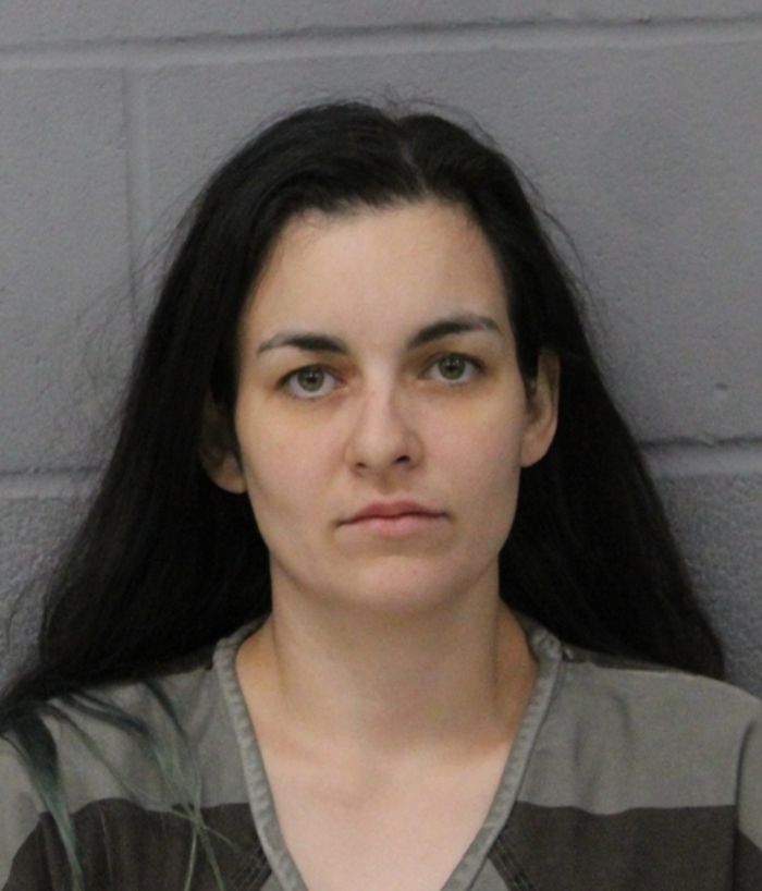 Mugshot of a woman related to a case where a woman was found chained in backyard for months after friends' rejection. Mugshot of a woman related to a case where a woman was found chained in backyard for months after friends' rejection.