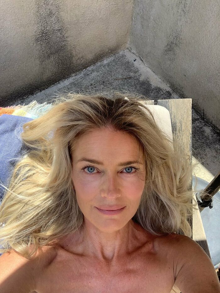 Paulina Porizkova, 60, with natural look and bare shoulders embracing perfect imperfections in unfiltered underwear photos.